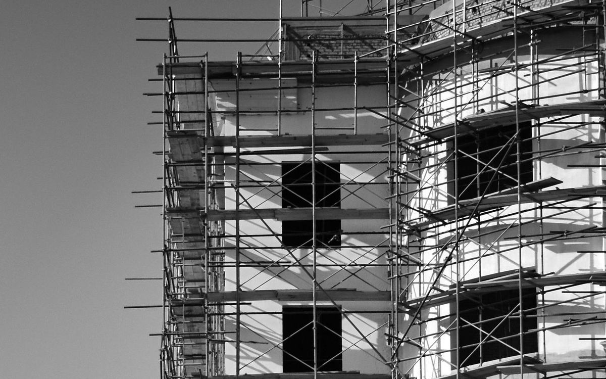 Alloy scaffold tower section against a building
